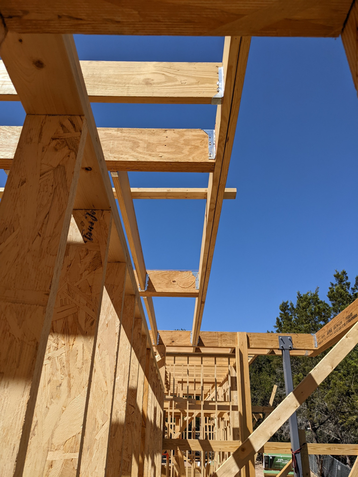Interior wood framing and sheathing of a new building under construction by Hill Country Framing in Austin, TX