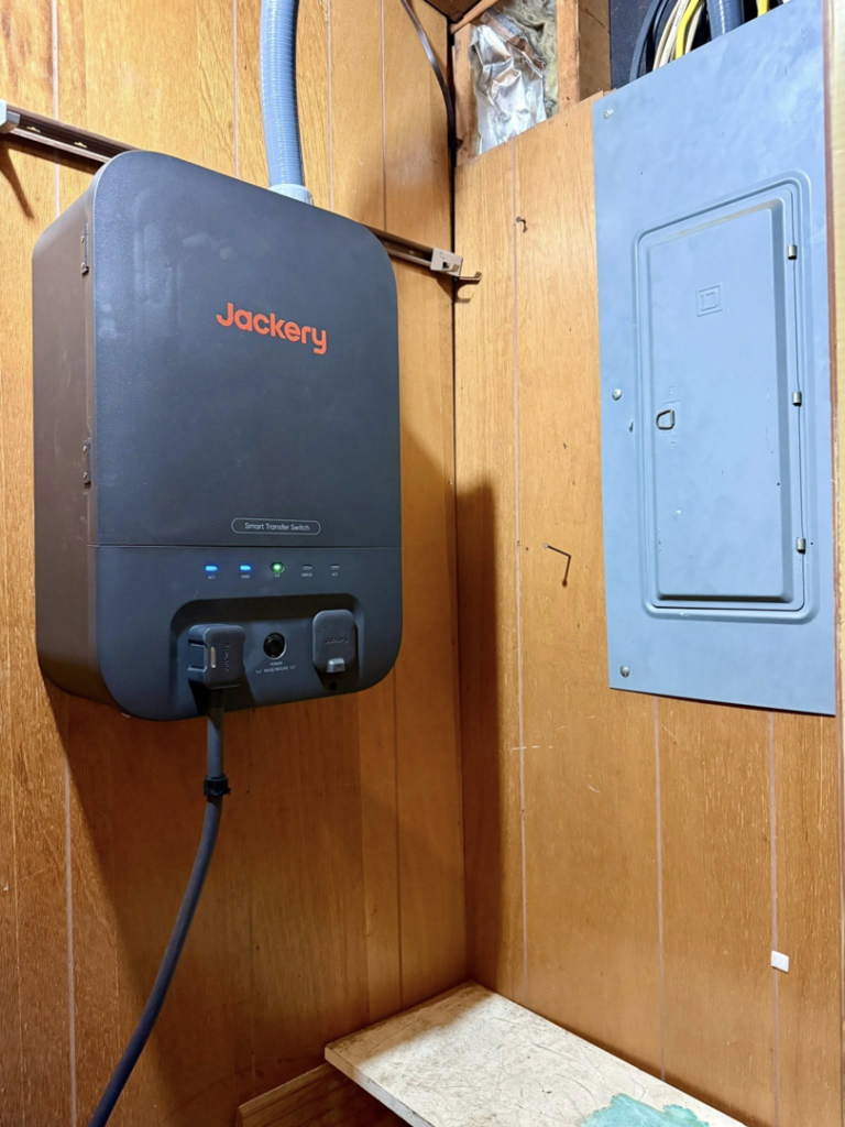 A Jackery Smart Transfer Switch installed next to an electrical panel by Morris Electrical Service in Hopkinsville, KY.