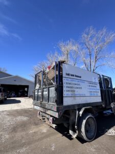 A Jedi Junk Removal Garbage Services Pocatello, ID, truck loaded with various items of junk for removal.