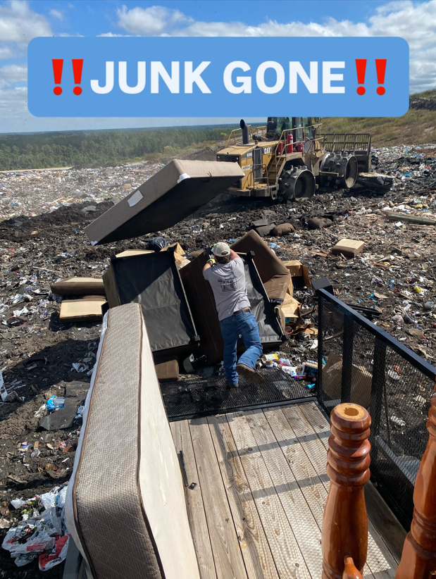 A Litter Hitters employee standing among successfully disposed junk at a landfill, showing a completed job in Jacksonville, FL.
