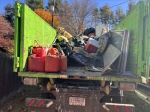 The back of a Junkluggers truck filled with various items of junk after a successful removal job in Hicksville, NY.