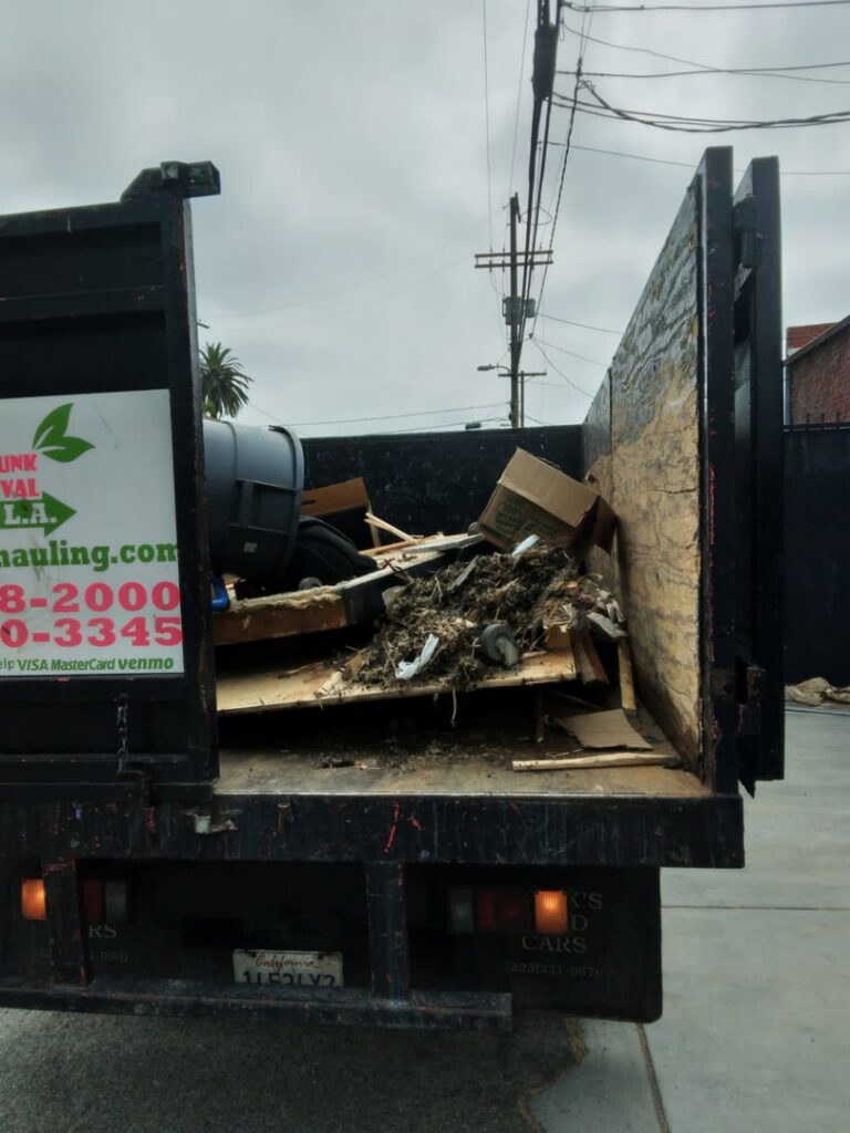 The bed of a West LA Hauling truck filled with various junk and debris after a removal job in Los Angeles, CA.