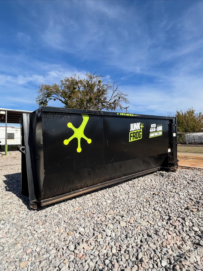 An empty Junk Frog dumpster ready for construction debris or large-scale junk removal in Oklahoma City, OK.