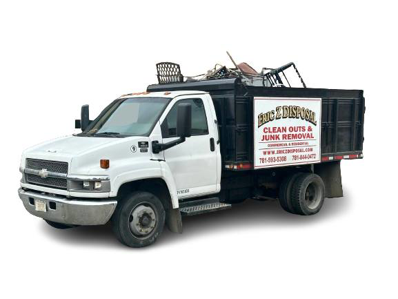 A junk hauling truck filled with debris and old furniture, provided by Robert Z Disposal in Lynn, MA.