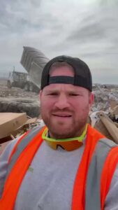 A Richie Bros Junk Removal team member at a landfill, disposing of collected junk in Urbandale, IA.