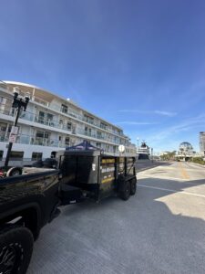 A Junk Removal JAX truck and trailer parked in Jacksonville, FL, ready for a general junk removal job.