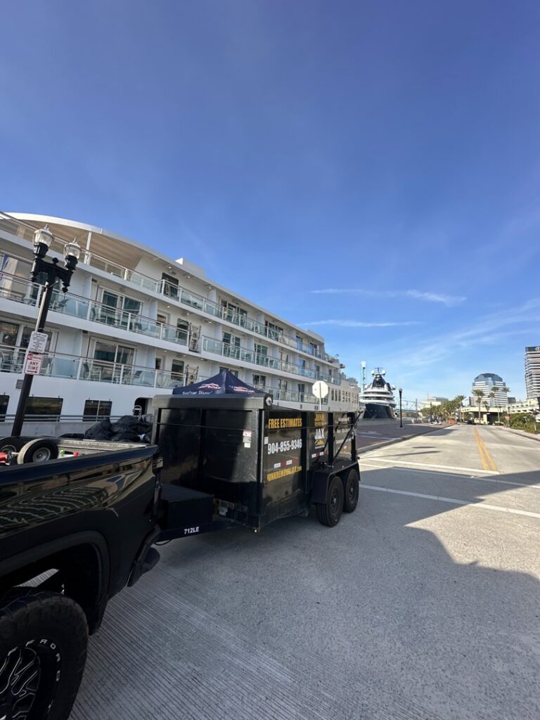 A Junk Removal JAX truck and trailer parked in Jacksonville, FL, ready for a general junk removal job.