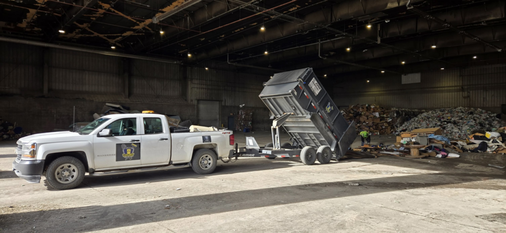 A Clean Sweep Junk Removal truck dumping a load of debris from a job at a transfer station in Augusta, ME.