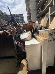 A junk removal truck completely full of furniture, boxes, and other debris after a job by L.A. Junk Squad in Bell Gardens, CA.