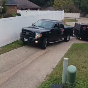 Junk Something llc truck and trailer leaving a completed junk removal job in Dallas, TX.