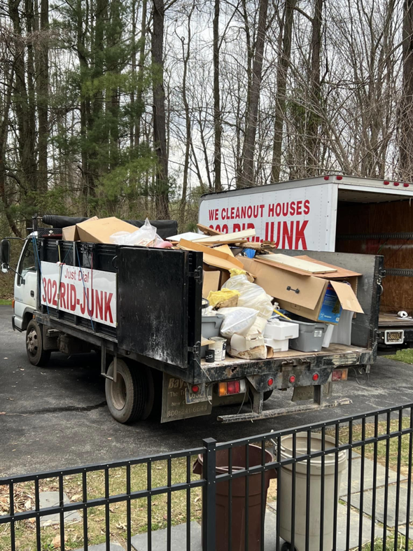 A 302-Rid-Junk truck loaded with debris and boxes after a successful junk removal job in Wilmington, DE.