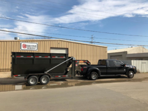 A Trashco DFW truck and dump trailer ready for general junk removal services in Dallas, TX