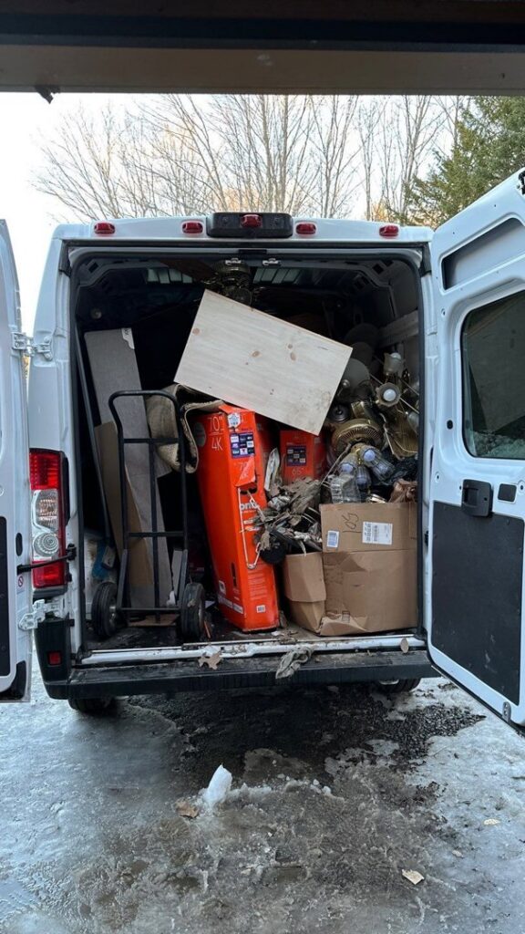 A Rubbish Doctor cargo van loaded with various items for junk removal in Portland, ME.
