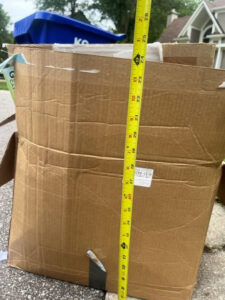 A wide view of the KC Disposal facility with trucks and dumpsters parked in Kansas City, KS.