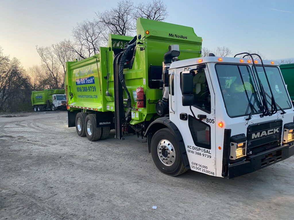 A fleet of KC Disposal garbage trucks parked, ready for junk removal services in Kansas City, KS.