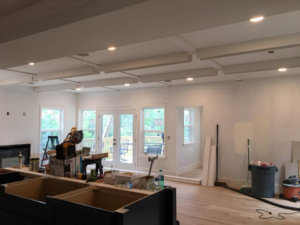 A kitchen area under construction with new cabinetry, ceiling work, and tools by DSD Construction in Saint Louis, MO.