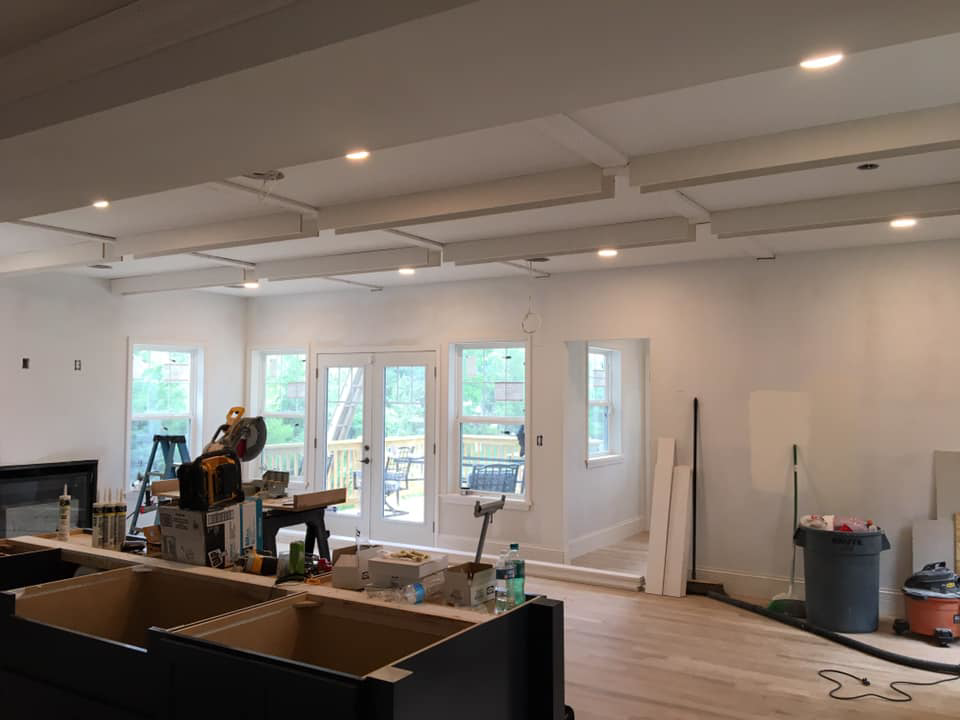 A kitchen area under construction with new cabinetry, ceiling work, and tools by DSD Construction in Saint Louis, MO.