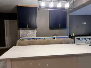 Kitchen backsplash and dark blue cabinet installation in progress by GD Home Remodeling in Annadale, VA.