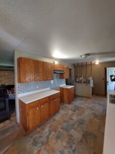 Kitchen featuring new backsplash and floor tile installed by True Alchemy - Tile & Grout Restoration in Denver, CO.