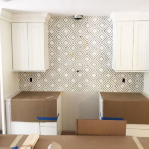 Professional kitchen backsplash installation with new white cabinets by CopperRock in Nashville, TN.