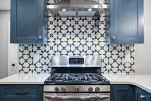 A newly installed kitchen backsplash and stove by JOMA Construction, providing handyman services in Athens, GA.