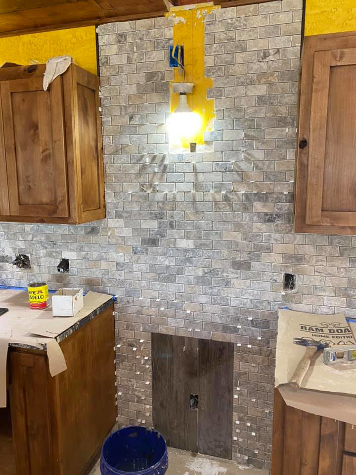 Kitchen backsplash tile installation in progress by Quality Craftsman Construction in Longwood, FL.