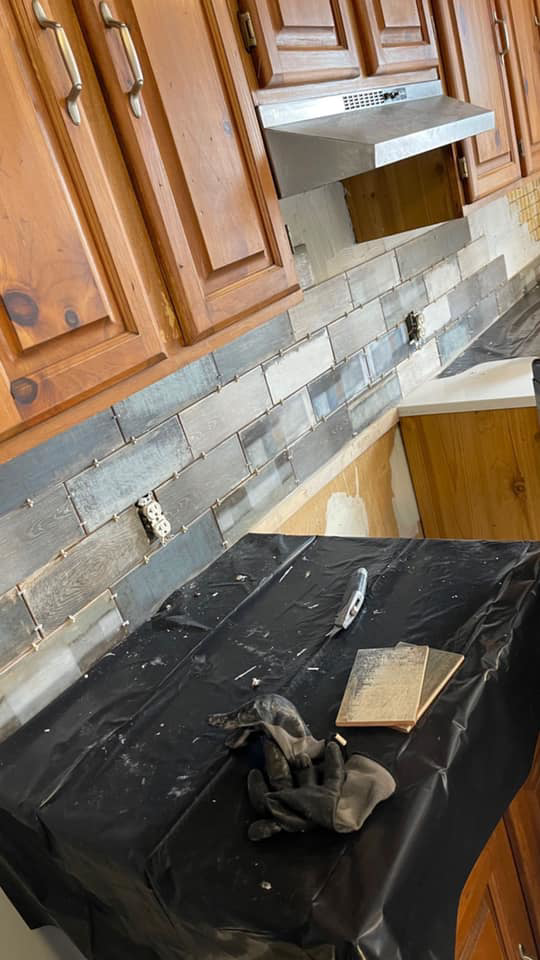 Close-up of kitchen backsplash tile installation in progress by Tawfiq Services LLC in Philadelphia, PA