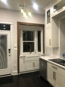 Kitchen with a new bay window and sink installation by Cabido Design, a handyman service in Brentwood, MD.