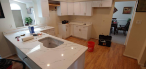 New kitchen cabinets and quartz countertops being installed by DAC Construction, Inc. in Laurel, MD.