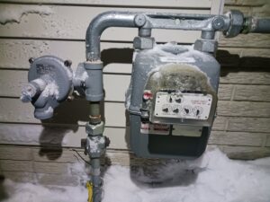 Newly installed black hardware on white kitchen cabinets, a service offered by Cedar Rapids On Call Handyman Service in Cedar Rapids, IA