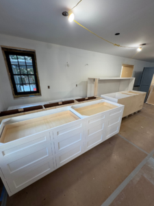 New kitchen cabinets being installed during a renovation project by Alloway Construction & Restoration Inc in Skillman, NJ