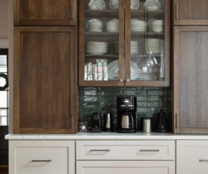 Custom kitchen cabinet installation featuring dark wood and light lower cabinets by Artisan Build Construct in Nashville, TN.