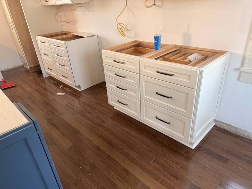 New white kitchen base cabinets being installed by E and C Handyman and Construction LLC in Owensboro, KY.