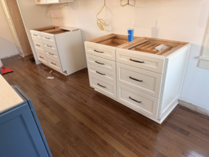 New white kitchen base cabinets being installed by E and C Handyman and Construction LLC in Owensboro, KY.