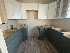 New kitchen cabinets being installed during a renovation project by EJL Construction, LLC in Roswell, NM.