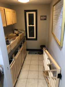 New kitchen cabinets being installed in a room by Elde Contracting in Saint Paul, MN.