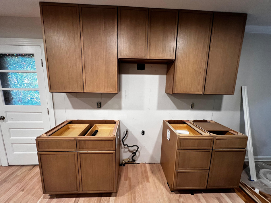 Kitchen cabinet installation in progress, showing upper cabinets and lower frames by GD Home Remodeling in Annadale, VA.