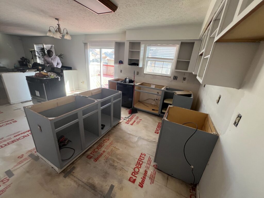 Kitchen renovation in progress with new cabinets being installed by Jarrett's Home Improvements & Maintenance Services in Columbus, OH