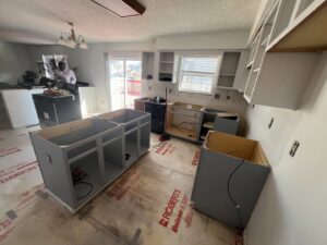 Kitchen renovation in progress with new cabinets being installed by Jarrett's Home Improvements & Maintenance Services in Columbus, OH