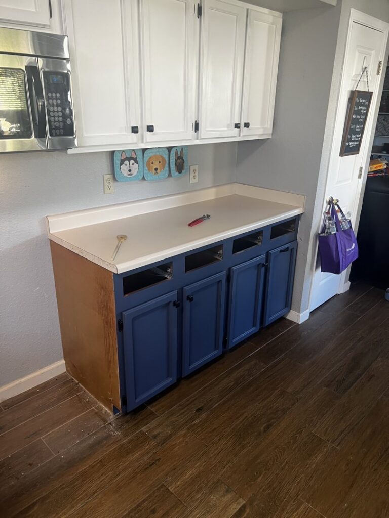 Kitchen cabinets in progress, featuring blue base cabinets and white upper cabinets by Lay's Remodeling LLC in El Paso, TX