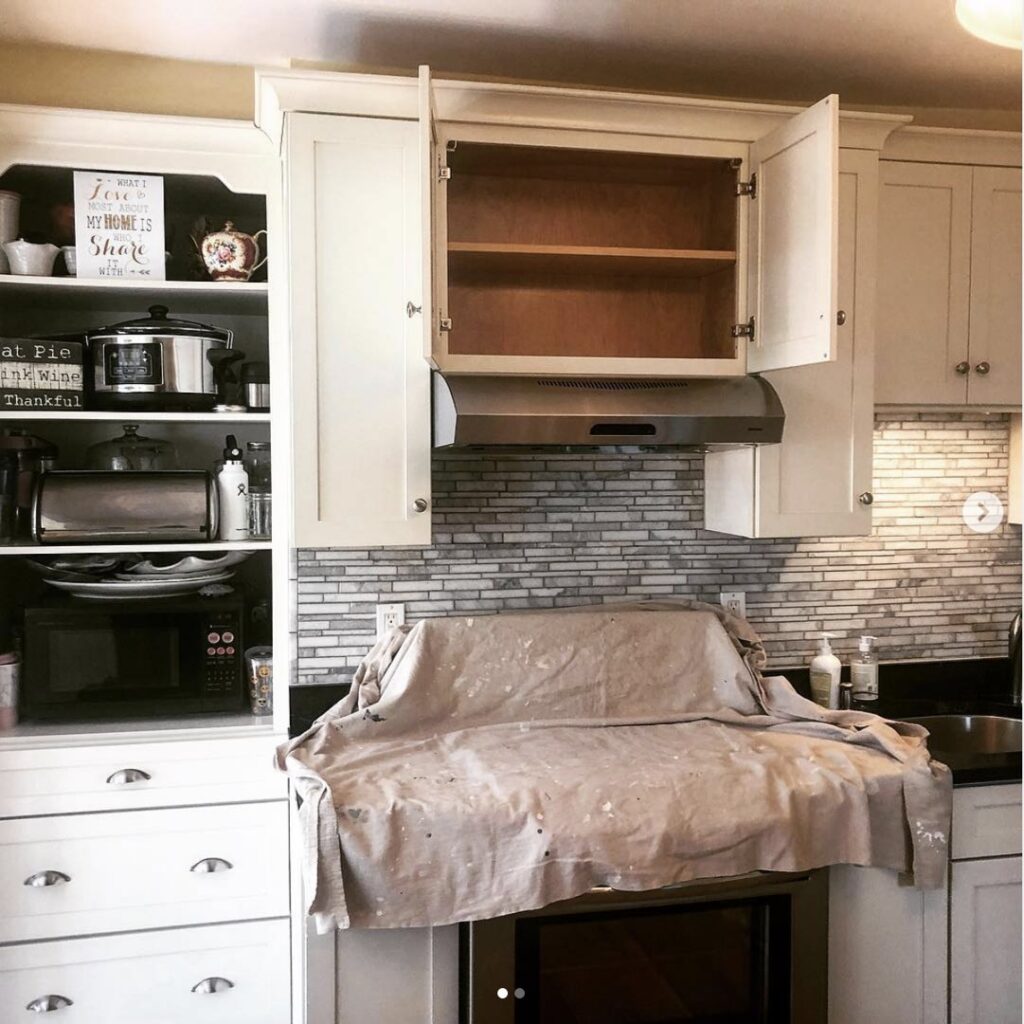 A kitchen undergoing renovation with open cabinets and a new backsplash installed by Paul Bergeron Jr. Contracting Inc. in Worcester, MA