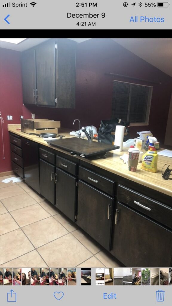 A kitchen counter with a paint tray and paint can, indicating cabinet painting in progress by Mancusi Home Maintenance in Boulder City, NV.