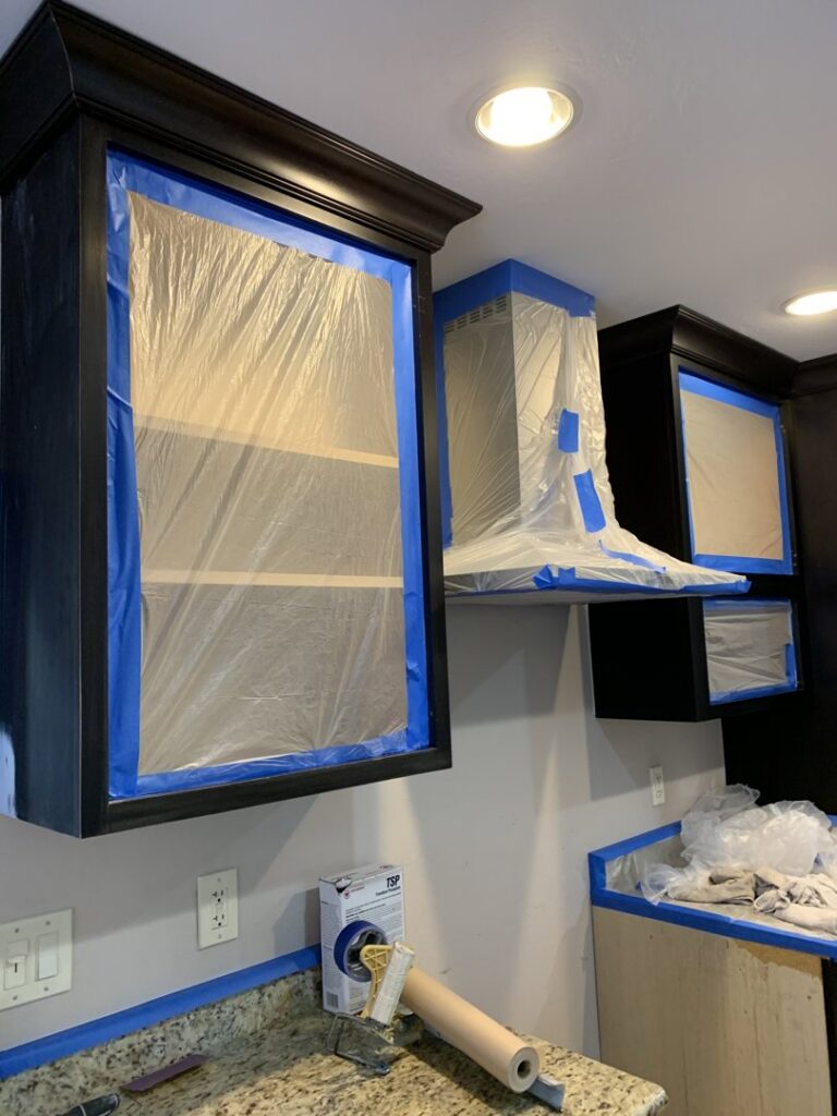 Kitchen cabinets and range hood prepped for painting or renovation by Kennyman The Handyman Inc. in San Francisco, CA