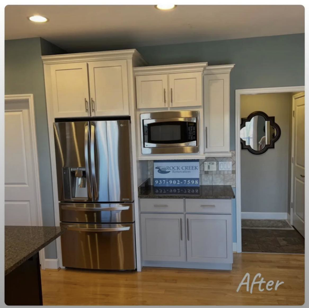 Kitchen cabinet painting and renovation with white and gray cabinets by Rock Creek Renovation and Painting in Waynesville, OH