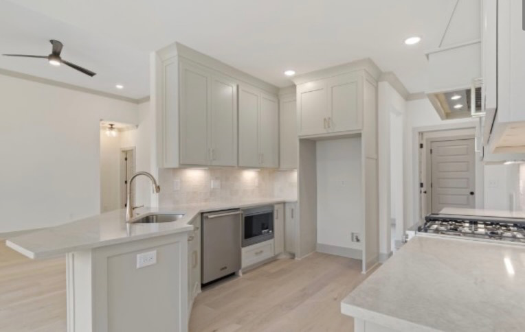 Kitchen cabinet, sink, and appliance installation services by Gray Builds in Columbia, TN.