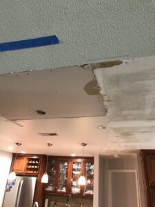 A kitchen ceiling with drywall removed for repair or renovation by Castle Drywall & Plaster in Chesapeake, VA.