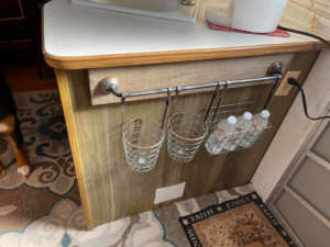 A newly installed kitchen counter hanging storage system by Douglas Allstott Handyman Service in Horner, WV.