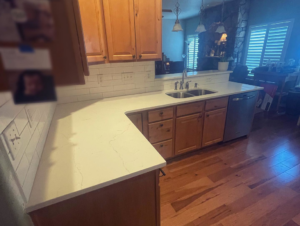 Kitchen update featuring new white countertops and a subway tile backsplash installed by Tanner Custom Carpentry in Loveland, CO.