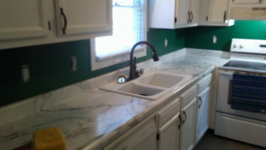 A newly installed kitchen countertop, sink, and faucet, showcasing renovation services by Handyman Services of Albuquerque in Albuquerque, NM.