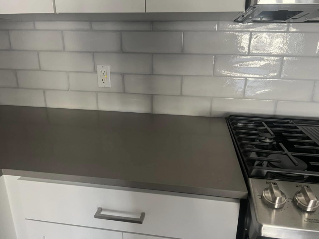 Clean kitchen countertop and subway tile backsplash installed by Fox Solutions Corp in Worcester, MA